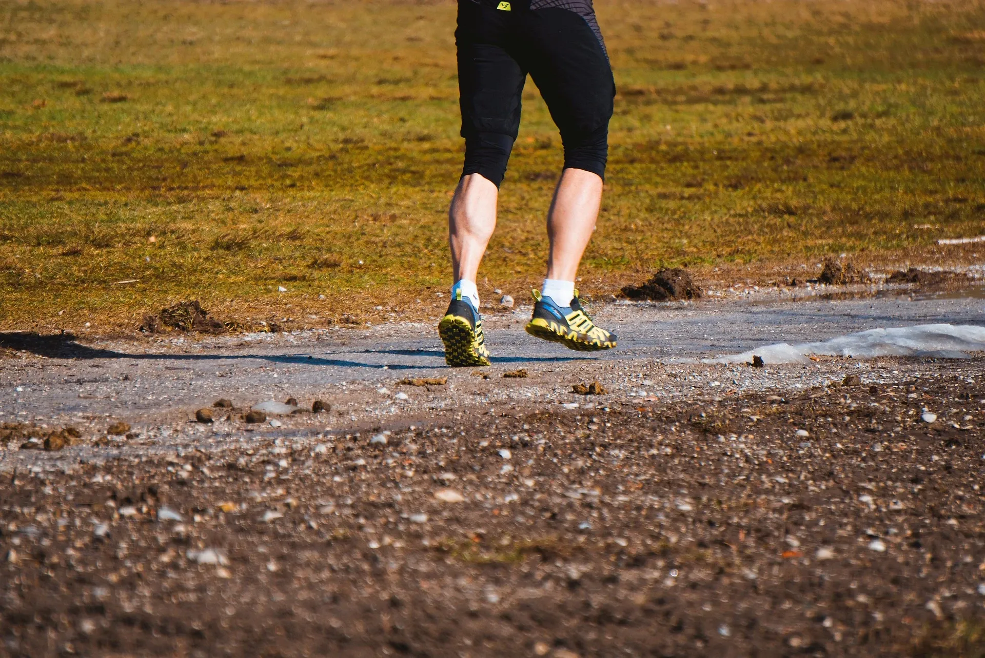 up close of man's legs running outdoors