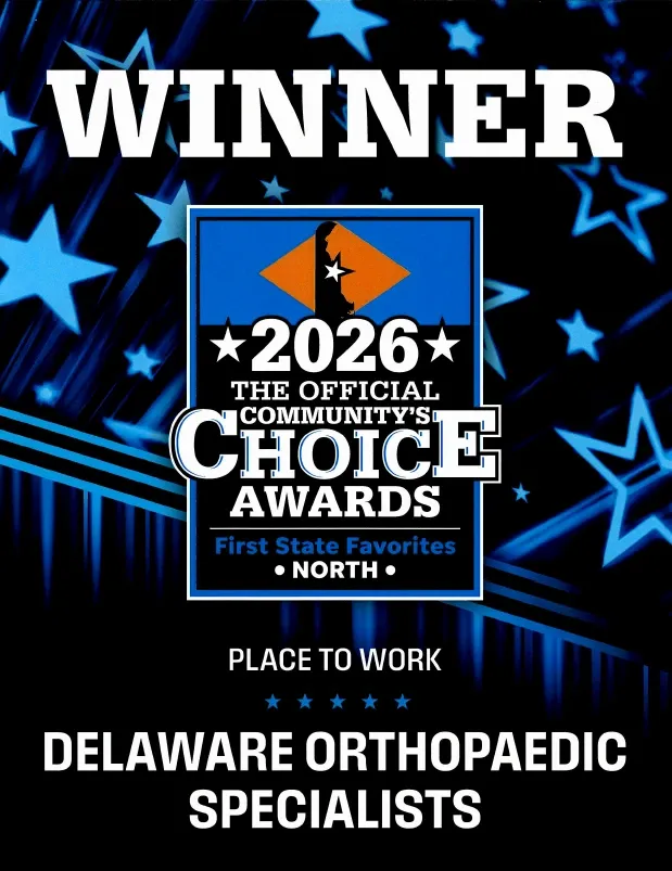 Orthopedic doctor smiling with elderly patient